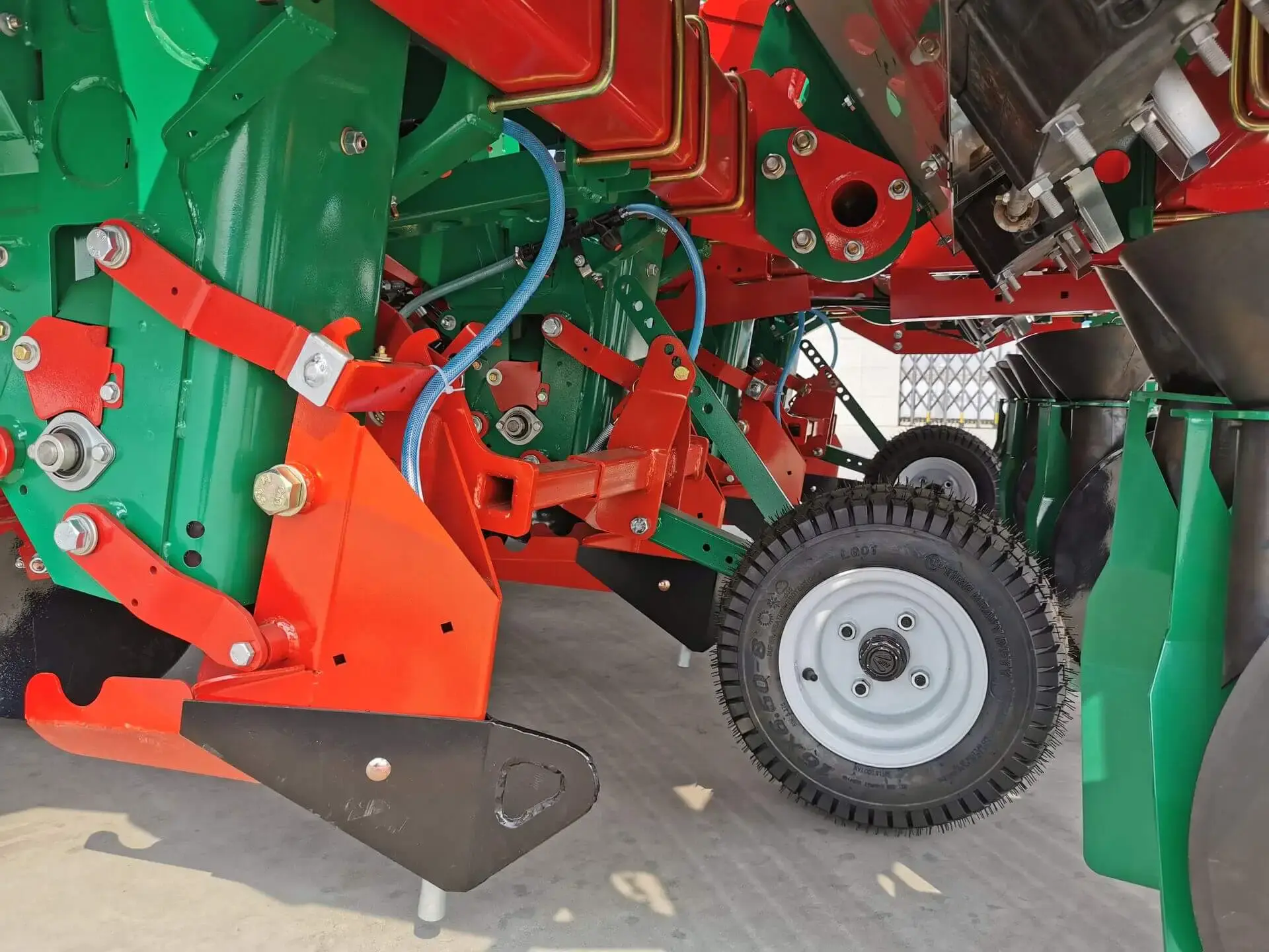 trenching and pesticide application components of a large trailed potato planter
